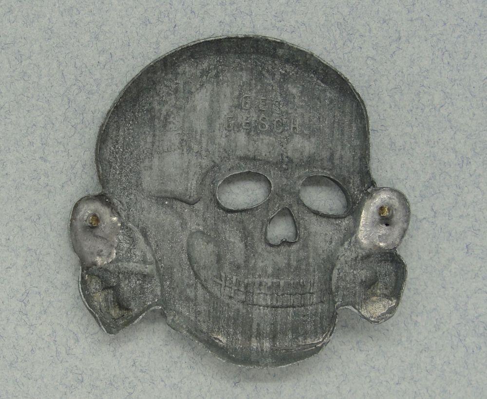 SS Visor Cap Skull by Assmann, marked "GES. GESCH.", Pins Gone